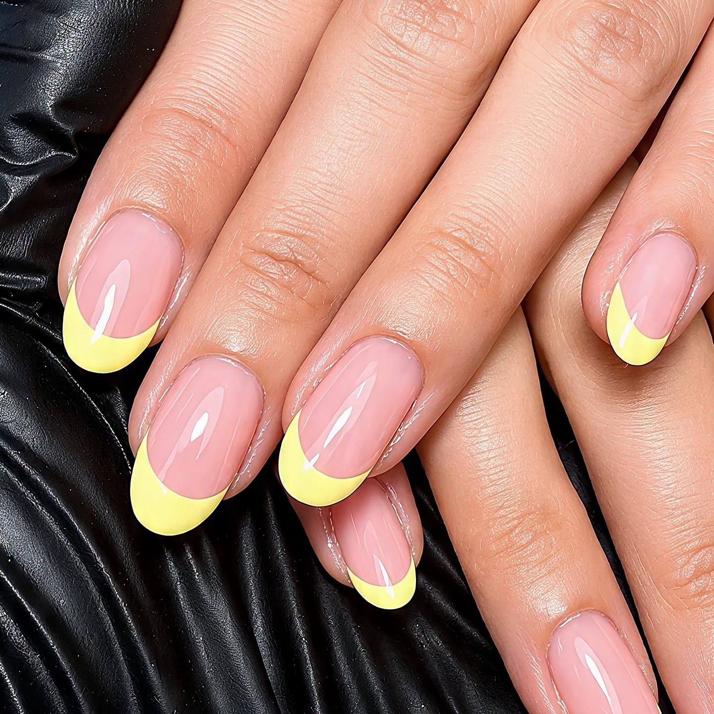 Pink nails with a bright yellow French tip manicure