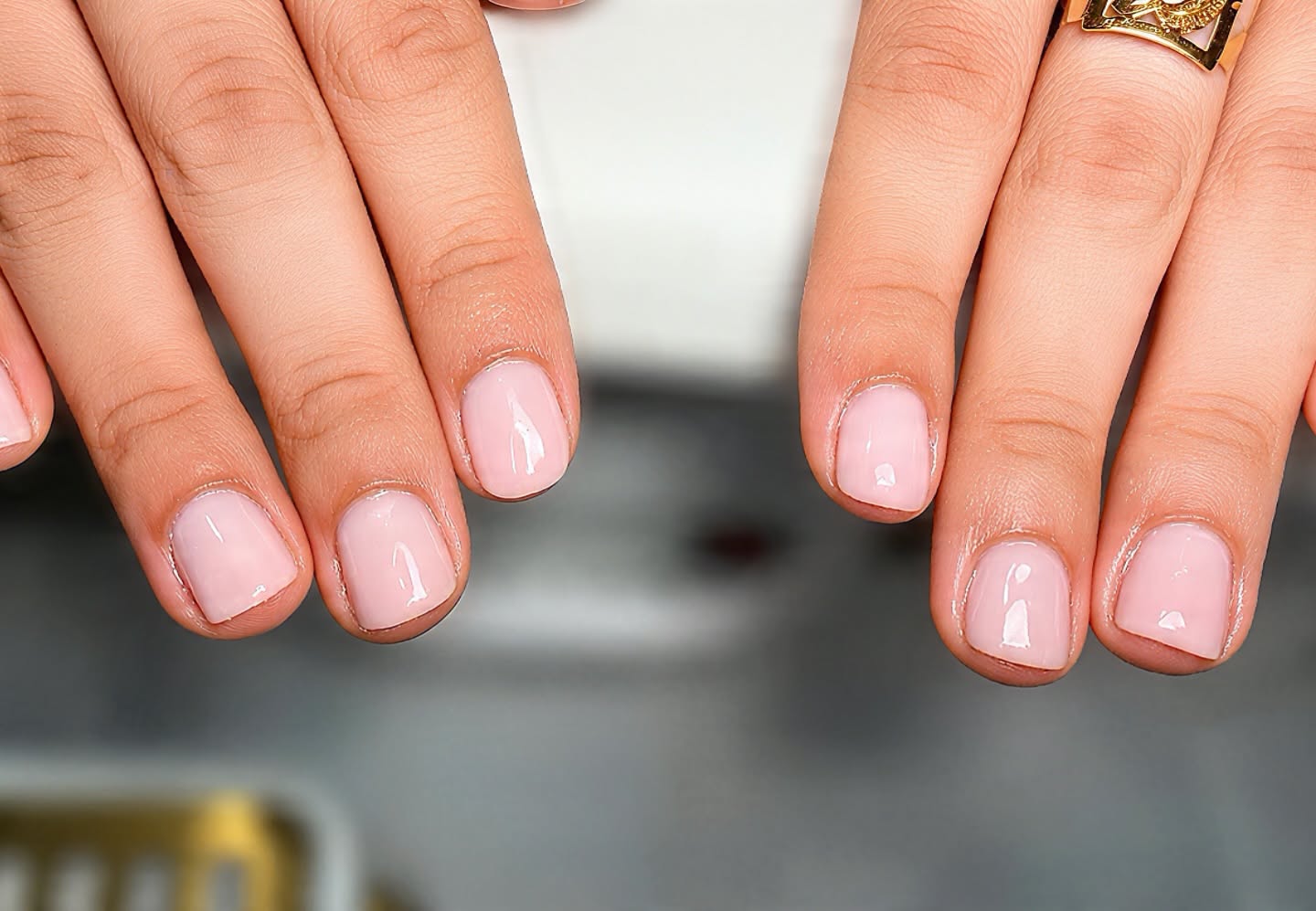 Close up of glossy pink manicured nails
